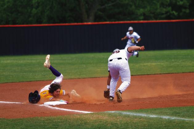 Rowdy Jackson does what he can with a Bristow base runner and a late throw at third base. Photo by Allie Prater
