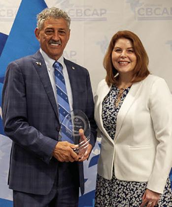 Right: Rep. John Talley, R-Stillwater, receives the Outstanding Elected Official Award from Lorri Essary, director of the Family Support and Prevention Service at Oklahoma State Department of Health.