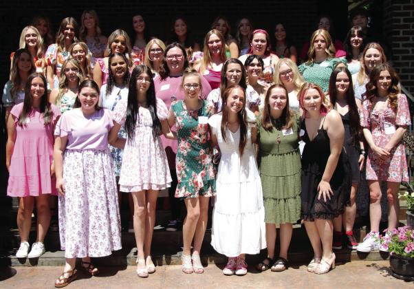 CHS senior girls enjoy the warm weather Monday, April 29, at the Senior Tea fashion show hosted by the Geographic Club of Cushing. Photo by Allie Prater