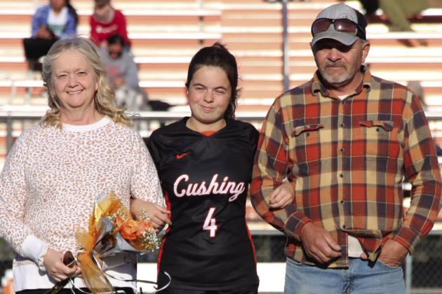 Center mid and defense for the Lady Tigers, Paige Leverich is escorted by her parents, Mike and Sonja Leverich. Photos by Allie Prater